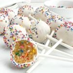 funfetti cake pops on a white plate.