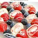 strawberry shortcake kabobs on a white plate.