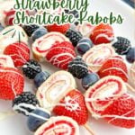 strawberry shortcake kabobs on a white plate.