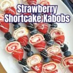 strawberry shortcake kabobs on a white plate.