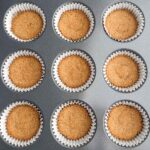 baked graham cracker crusts in a muffin tin.