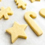 no spread cut out cookies on a cookie sheet.