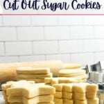 no spread no chill cut out sugar cookies stacked on a white countertop.