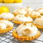 lemon meringue pie cookies on a wire baking rack.