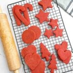 red velvet cut out cookies on a wire rack.