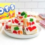 gumdrop marshmallow nougat squares on a white plate.