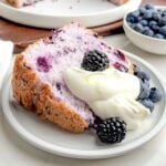 blueberry angel food cake topped with lemon whipped cream.