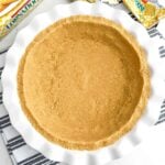 shortbread crust in a white pie plate.