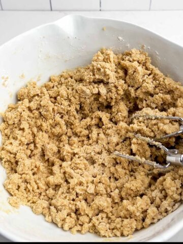 chocolate chip cookie dough in a white bowl.