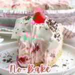 slice of no bake cherry pie topped with whipped cream, chocolate shavings, and a cherry with a bite missing.