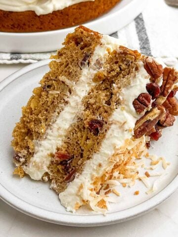 slice of hummingbird cake on a white plate.