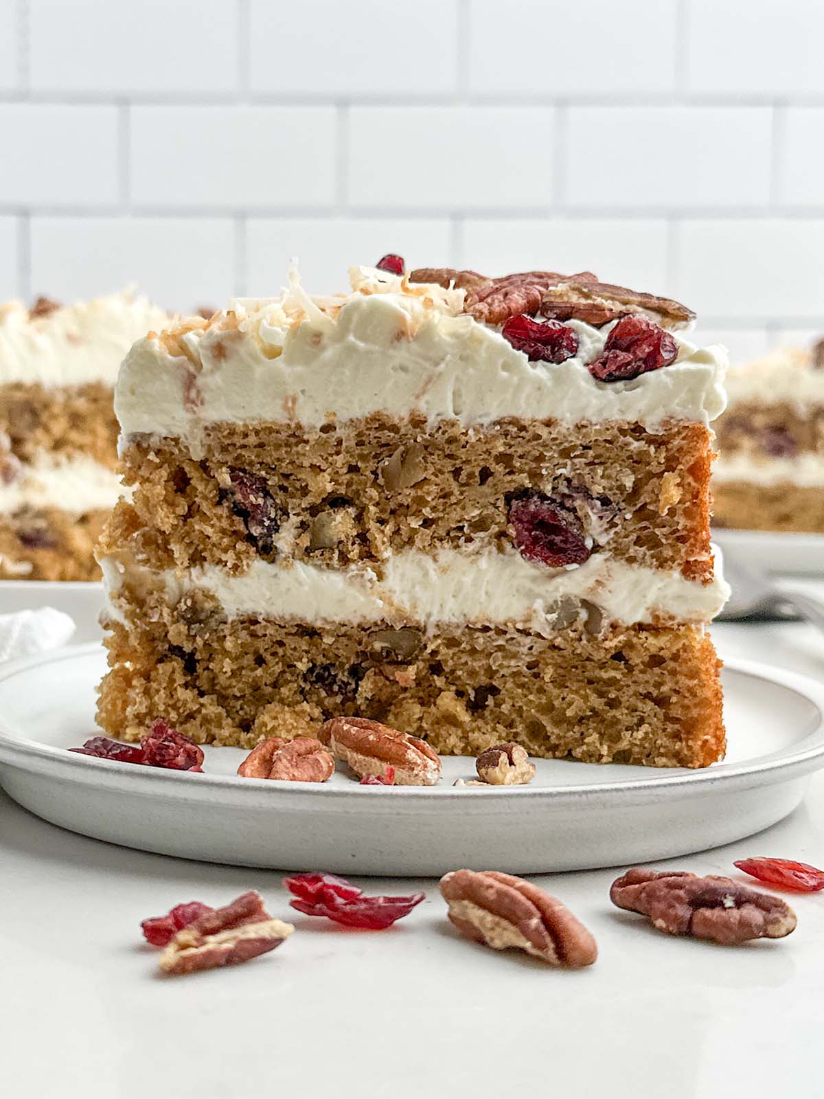 slice of hummingbird cake on a white plate.