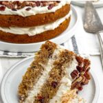 slice of hummingbird cake on a white plate.