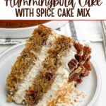 slice of hummingbird cake on a white plate.