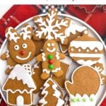 soft gingerbread cookies with icing on a white plate.