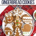 soft gingerbread cookies with icing on a white plate.