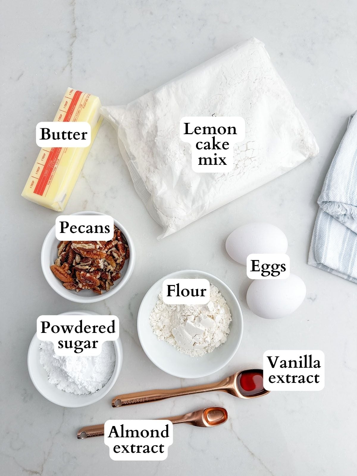 cake mix lemon snowball cookie ingredients on a white countertop.