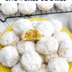 lemon snowball cookies on a yellow plate.