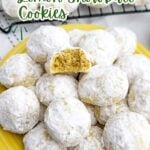 lemon snowball cookies on a yellow plate.