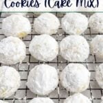 lemon snowball cookies rolled in powdered sugar on a baking rack.