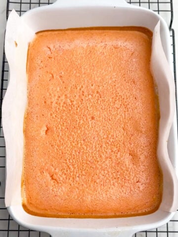 baked grapefruit bars in a white baking dish.