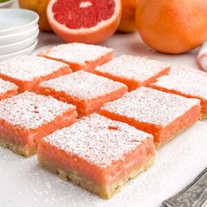 grapefruit bars on a white plate.