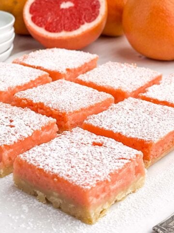 grapefruit bars on a white plate.